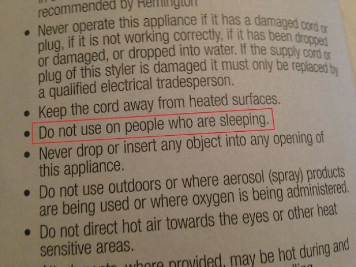 Safety manual with hilariously confusing instructions warning not to use appliance on sleeping people.