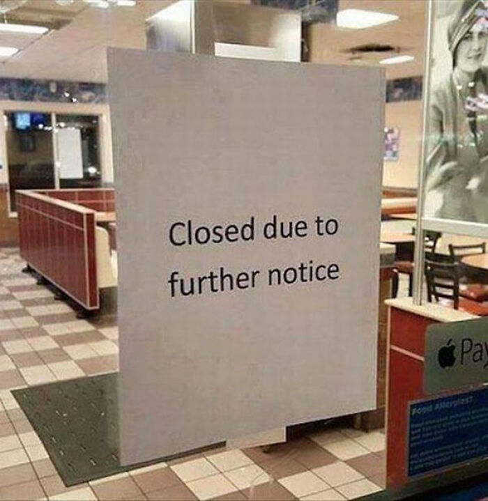 A restaurant window sign reading closed due to further notice, highlighting translation fails.