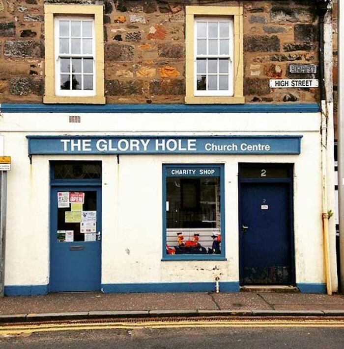 A funny translation fails sign for a church charity shop titled The Glory Hole Church Centre.