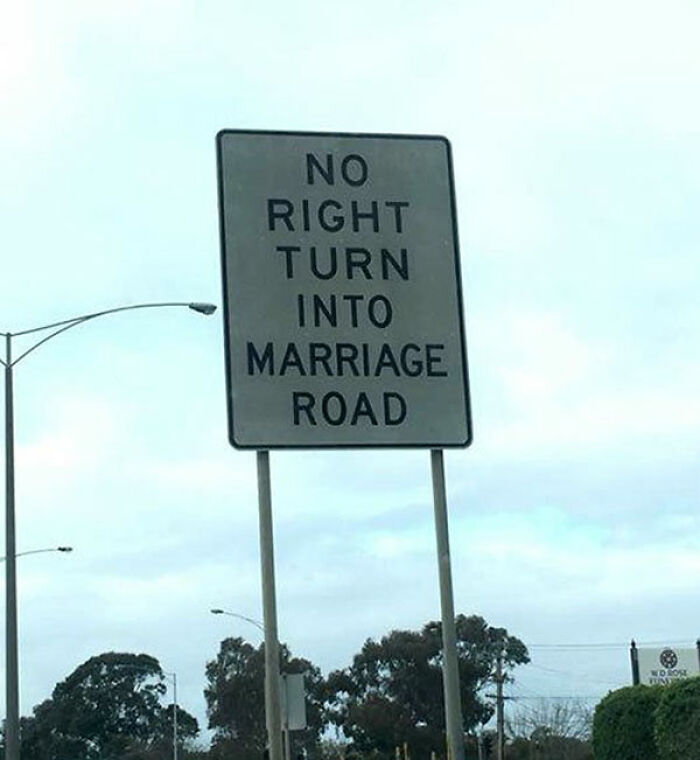 Street sign featuring a translation fail that says No right turn into Marriage Road