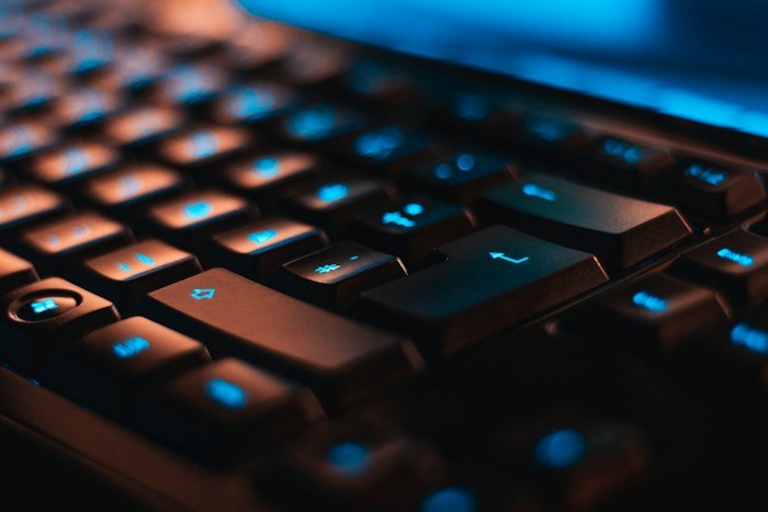 Close-up of backlit computer gaming keyboard rescued from dumpster finds.