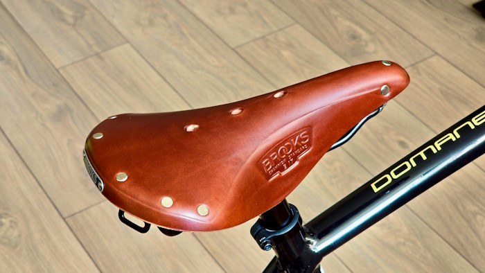 Close-up of a high-quality leather Brooks bicycle saddle found while dumpster diving.