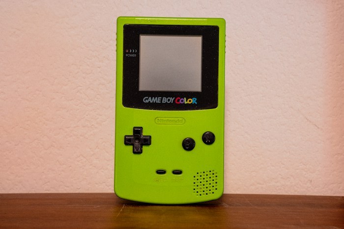 A lime green Game Boy Color standing vertically, illustrating incredible dumpster finds.