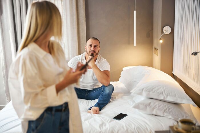 Tense couple in a bedroom during petty family feuds leading to legal disputes