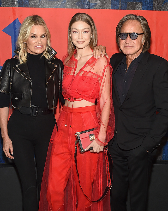 Gigi Hadid with parents Yolanda and Mohamed Hadid posing at an event Gigi Hadid with parents Yolanda and Mohamed Hadid posing at an event
