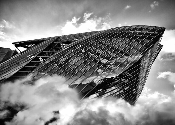 A modern glass building appearing to rise above clouds, from The Perspa Awards 2026 collection
