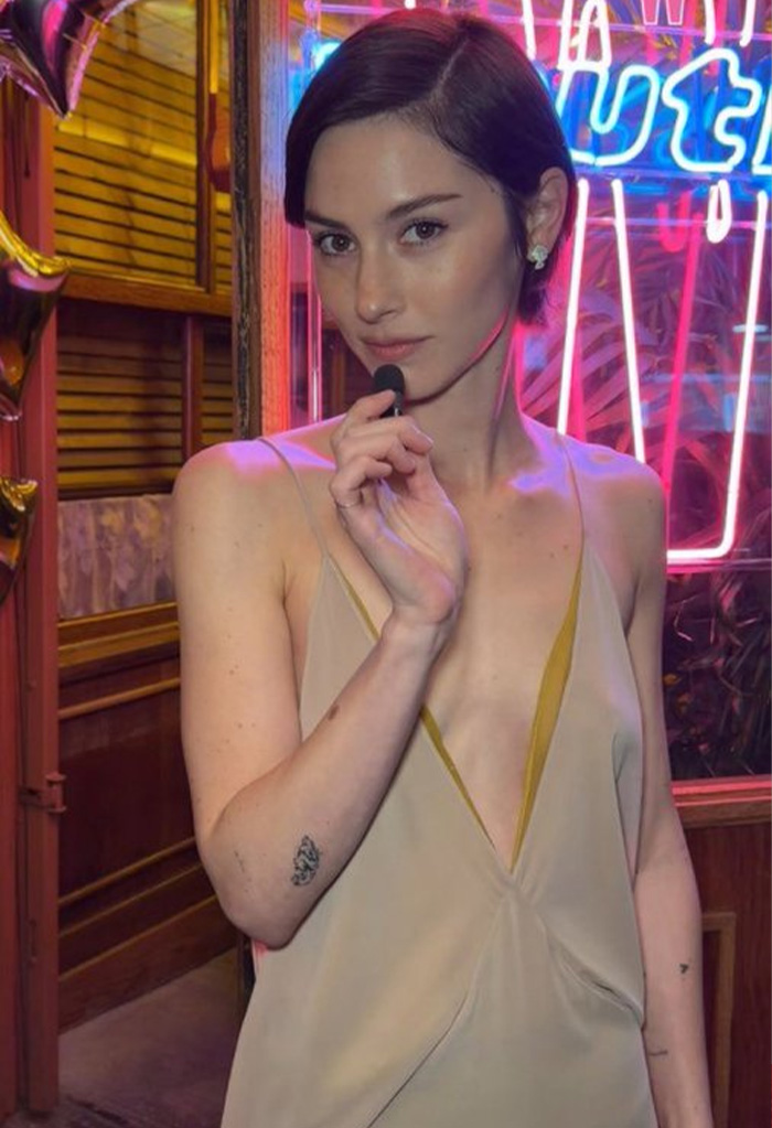 Gracie Abrams posing at a party showing her recent physical transformation.