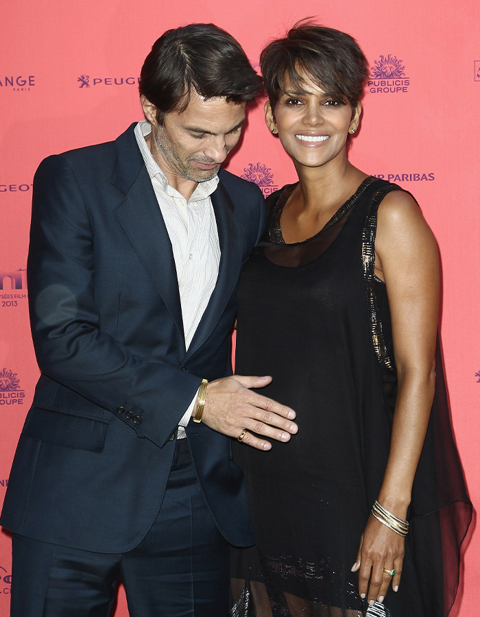 Olivier Martinez touching Halle Berry's belly as she smiles. Olivier Martinez touching Halle Berry's belly as she smiles.