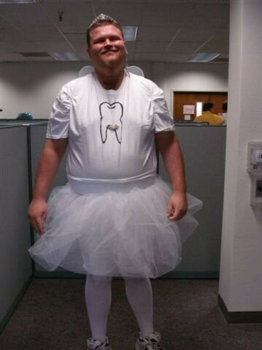 A man wearing a funny tooth fairy outfit, offering creative Halloween costume ideas.