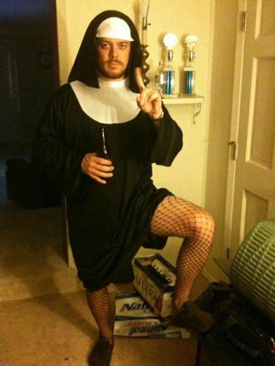 Man dressed in a nun habit and fishnet tights as a creative Halloween costume idea