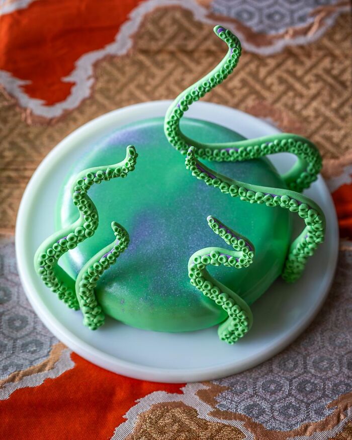 Green cake with creepy tentacles as Halloween foods.