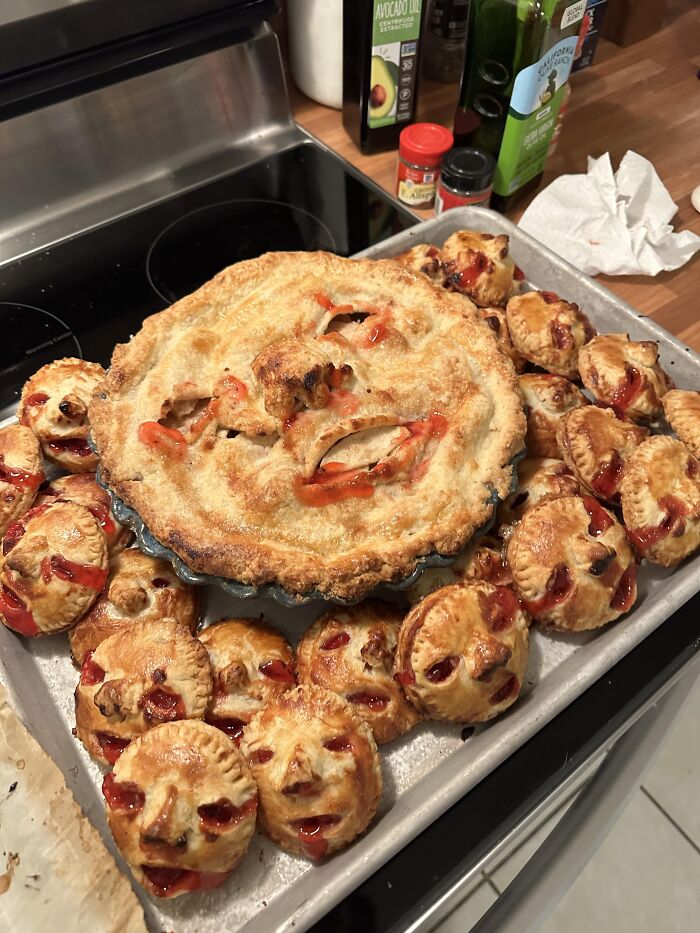Cherry pie and mini pastries crafted to look like creepy screaming faces for spooky Halloween foods.