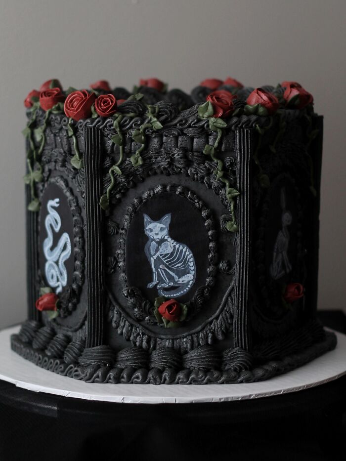 Ornate black gothic cake featuring skeleton cat art as unique Halloween foods