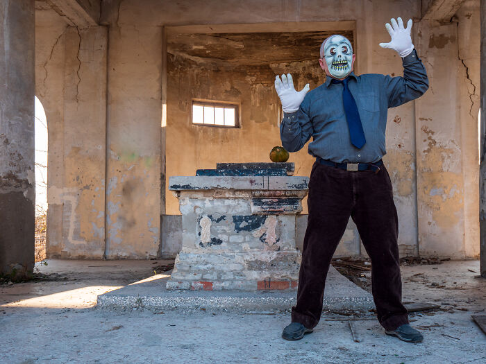 Man in scary mask posing in haunted house for funny haunted house stories