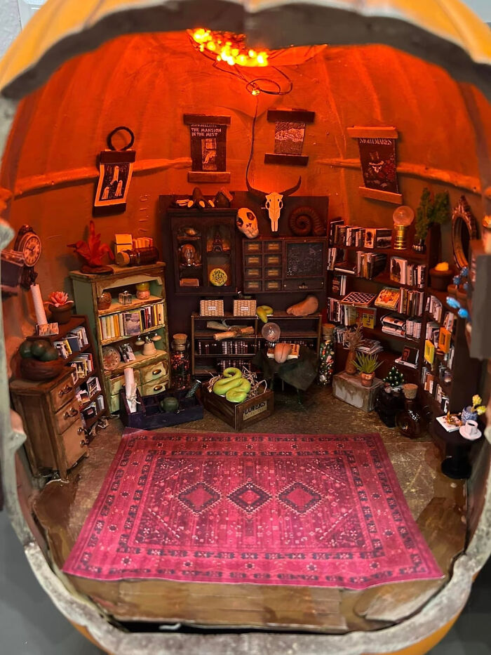 Miniature haunted witch library diorama inside a pumpkin home decorated for Halloween