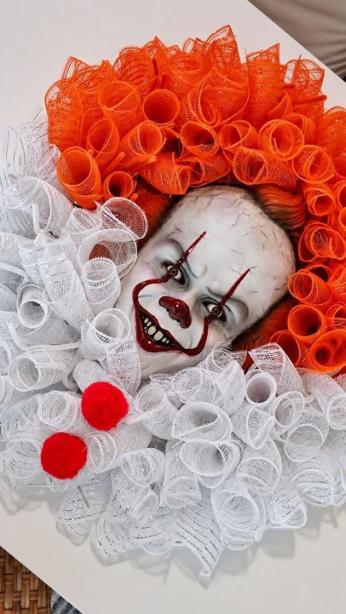 Scary Pennywise clown wreath decoration adding spooky Halloween vibes to a home