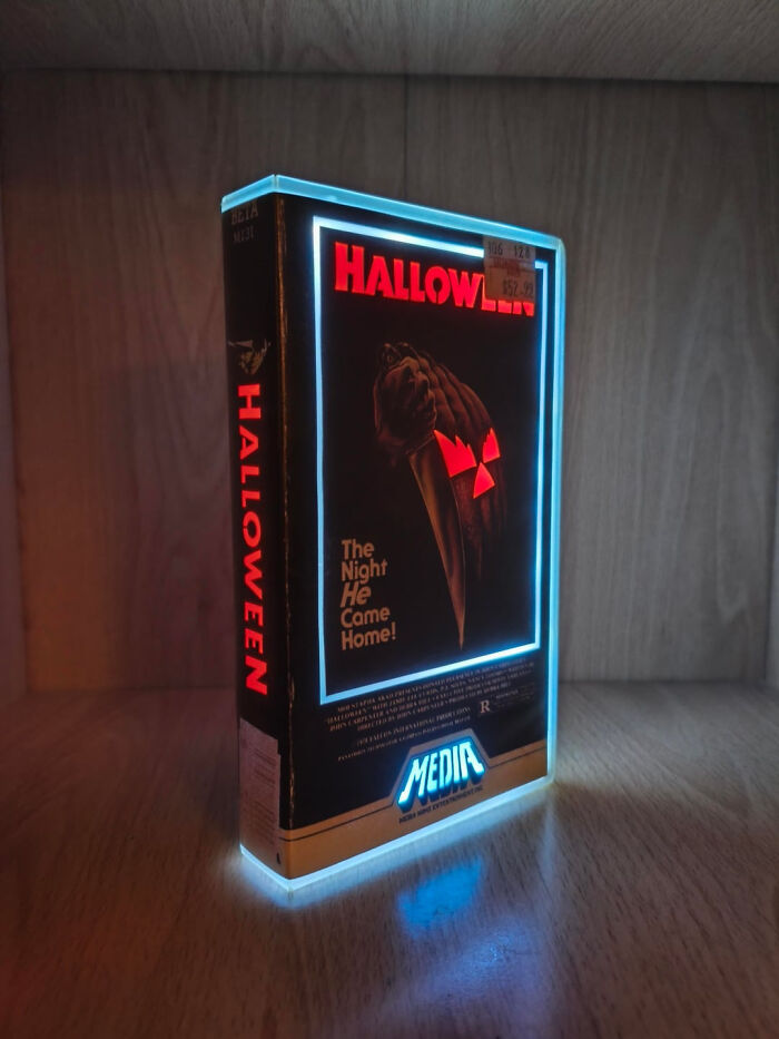 A retro illuminated VHS video tape light for the classic Halloween horror movie on a shelf.