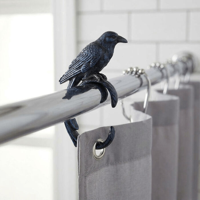 Black crow shower curtain hook adds a subtle Halloween theme.