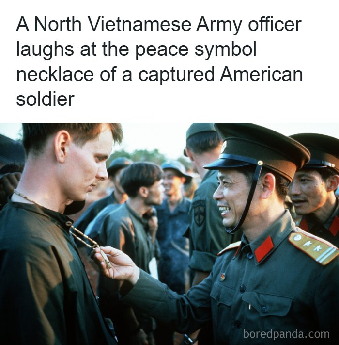 A North Vietnamese officer looking at an American soldier necklace showcasing interesting facts about the world around us
