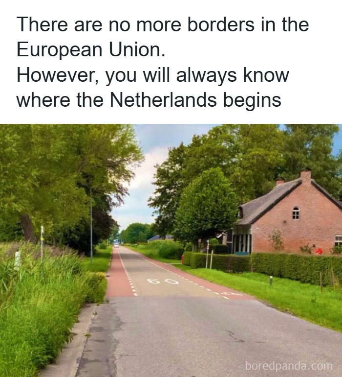 Paved road crossing into Netherlands marked by cycle lanes, interesting facts about world