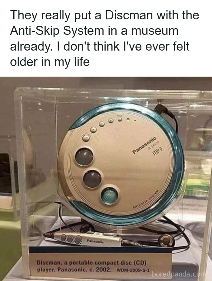 A vintage Panasonic Discman CD player displayed in a museum case evoking nostalgic tech memories