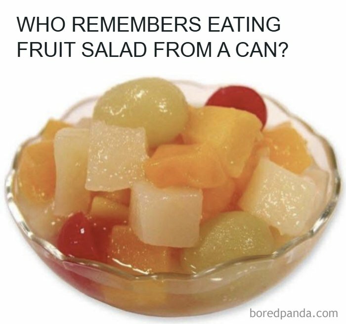 A bowl of canned fruit salad with cherries, peaches, and pears, bringing back nostalgic dessert memories.