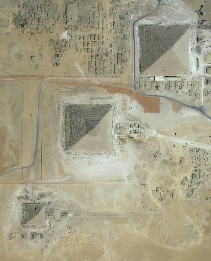 Top-down satellite photo of the ancient Giza pyramids in Egypt.