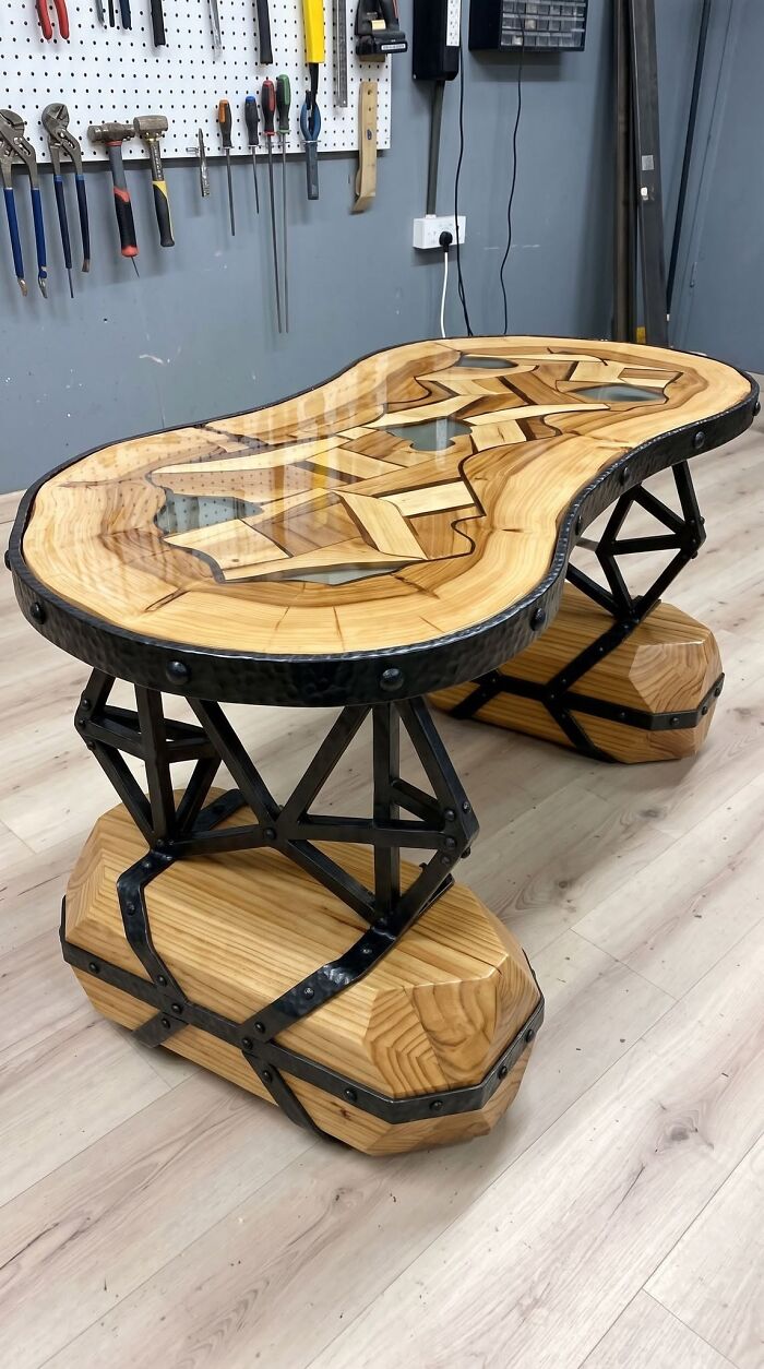 An artistic wooden table with a geometric glass inlay, illustrating clever wooden creations for the home.