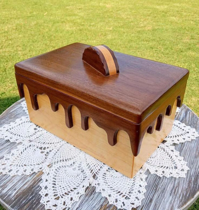 A decorative wooden jewelry box featuring a chocolate-drip design, showcasing clever wooden creations.