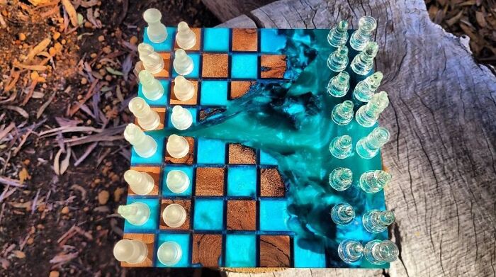 An artistic chess set made of epoxy resin and wood, showcasing clever wooden creations