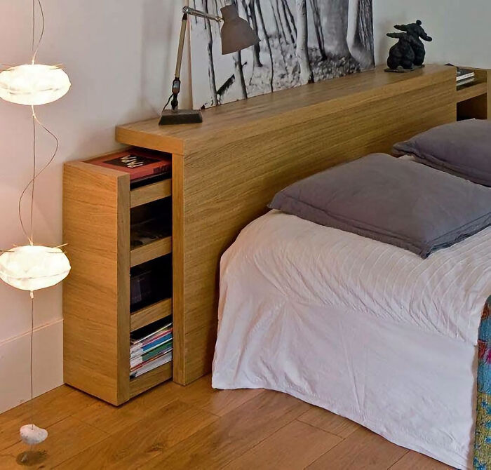 Smart bed headboard with pull-out storage, part of clever wooden creations