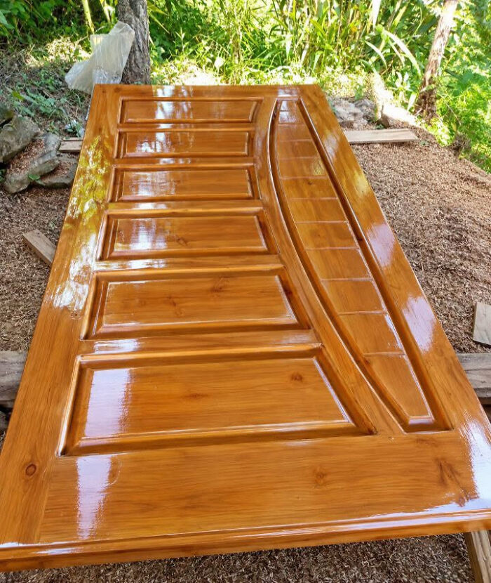Glossy varnished wooden door, one of many clever wooden creations