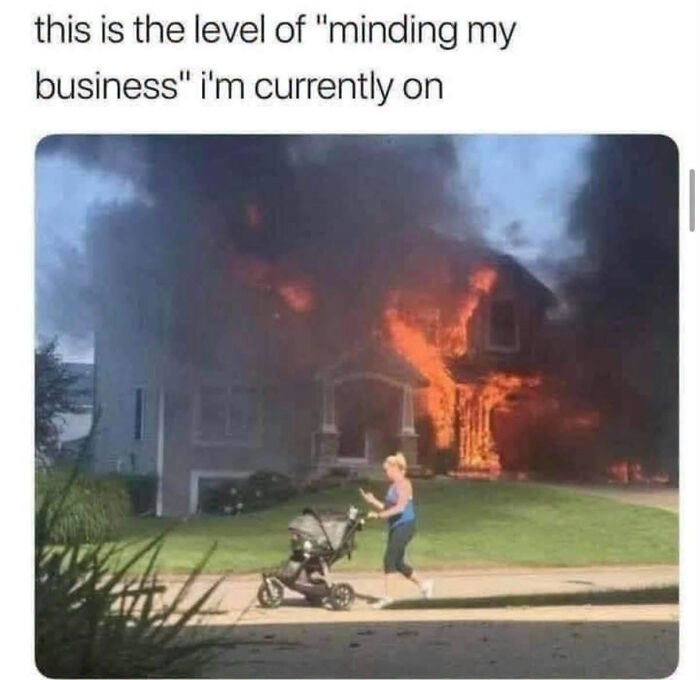 Woman pushing stroller past a burning house, illustrating edgy memes about minding your own business.