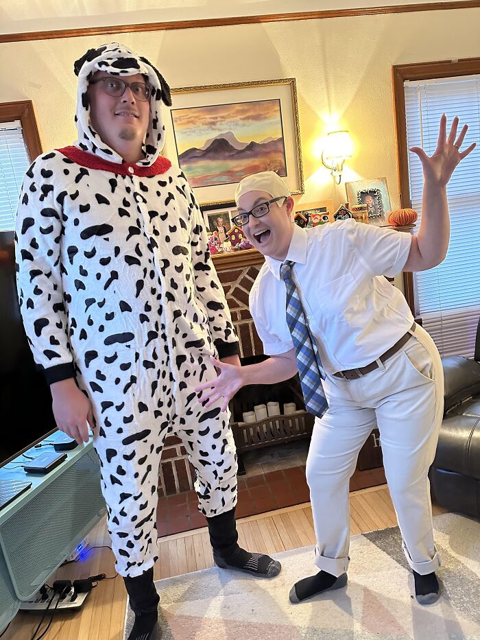 A person in a dalmatian suit and a person in a office shirt present funny Halloween couples costumes