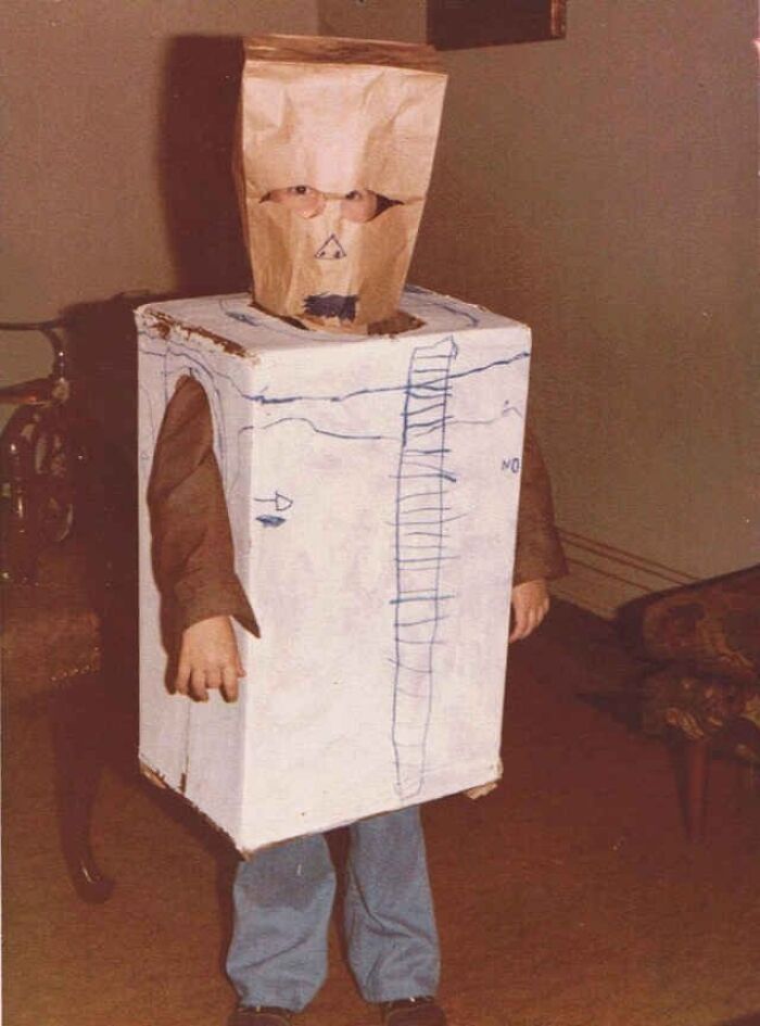 Funny Halloween costume made from a cardboard box and a paper bag over the head.