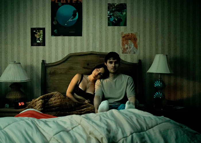 Man and woman on bed under dim light, related to the Cornell 7 case