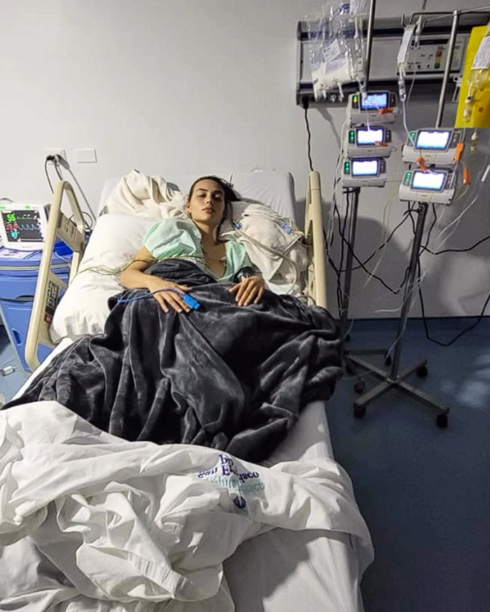 A young influencer resting in an ICU bed with medical equipment after eating sushi A young influencer resting in an ICU bed with medical equipment after eating sushi