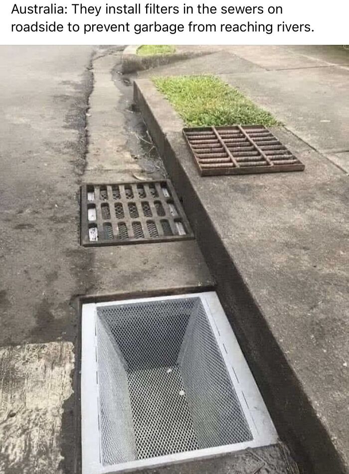 A roadside storm drain with a mesh filter basket installed to capture trash