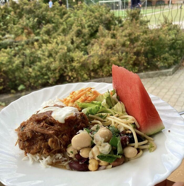 Useful things in various parts of the world: A balanced meal served on a plate with fresh watermelon.