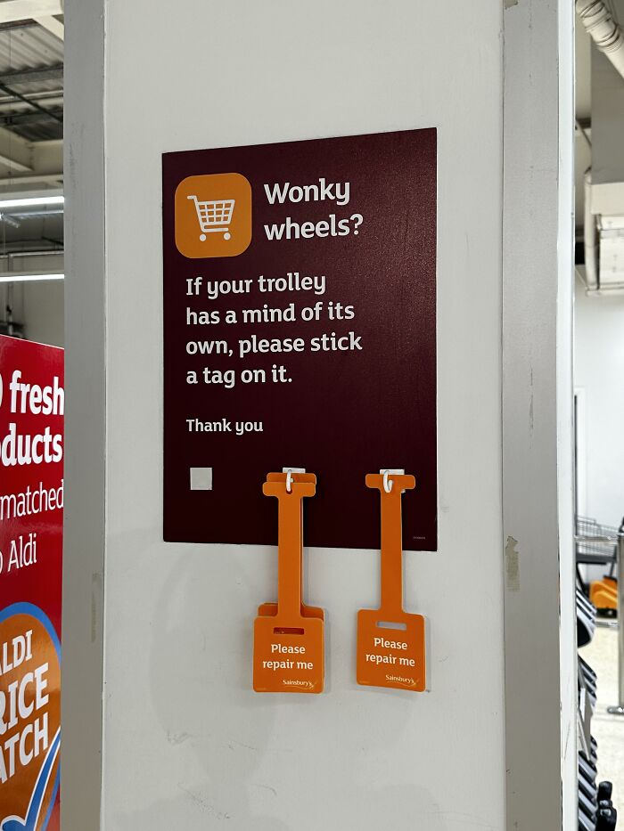 Supermarket sign for reporting broken shopping trolley wheels showing ingenious public ideas