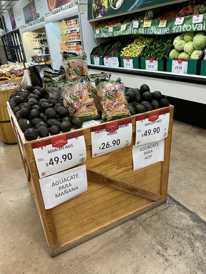 Ingenious things in supermarket: avocados separated by ripeness into today and tomorrow bins.