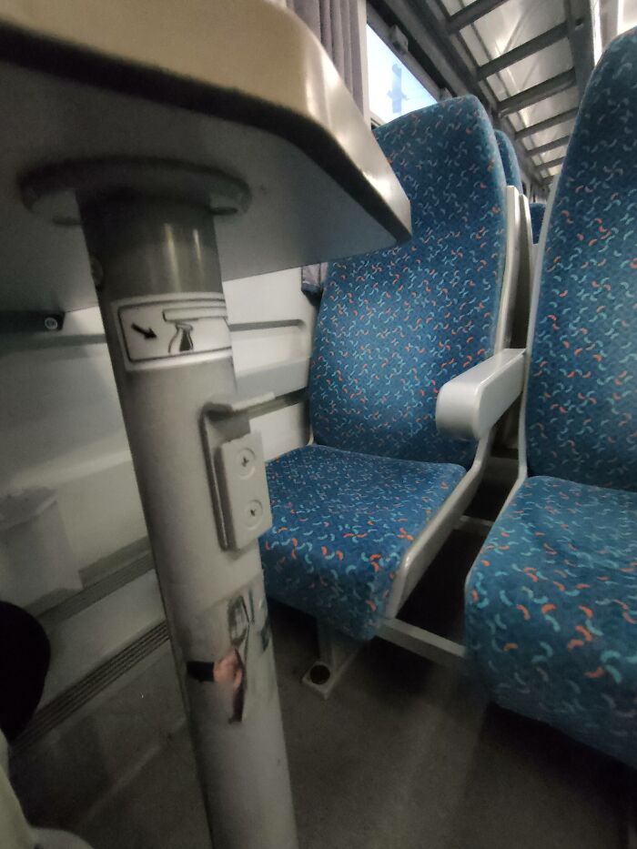 Train seat with built in bag hook showing ingenious things around the world