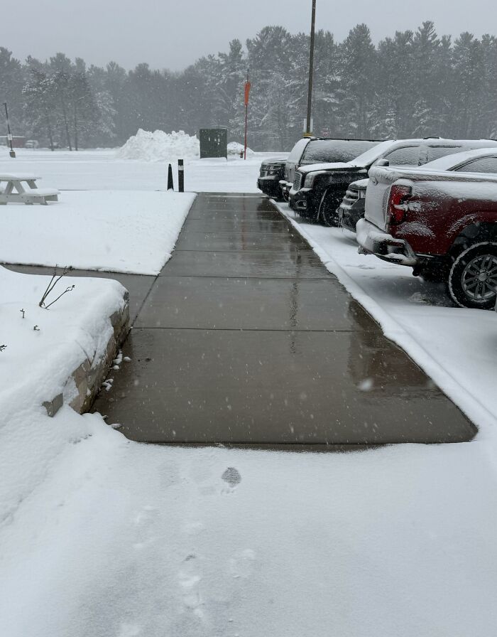 Heated sidewalk clear of snow, one of many ingenious things in various parts of the world.