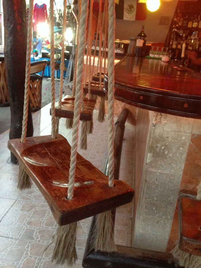 Bar seating featuring wooden swings suspended from the ceiling as ingenious things in various parts of the world.
