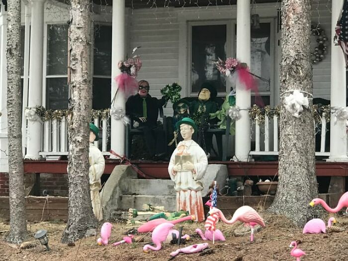 An unsettling front porch filled with strange mannequins and decorations from creepy photos.