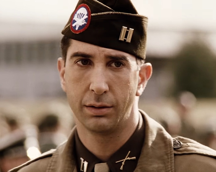 Close-up of a soldier in historical World War II uniform and cap Close-up of a soldier in historical World War II uniform and cap