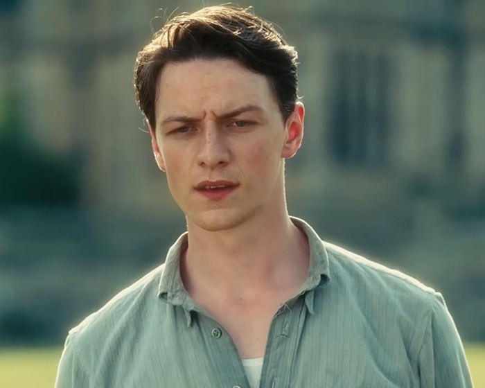 Young man in casual shirt looking concerned in outdoor setting Young man in casual shirt looking concerned in outdoor setting