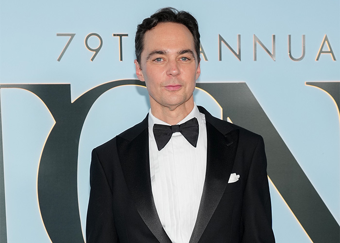 Jim Parsons wearing a tuxedo at a formal red carpet event. Jim Parsons wearing a tuxedo at a formal red carpet event.