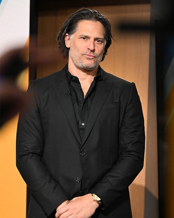 Joe Manganiello in a black suit looking directly at the camera with a slight smile Joe Manganiello in a black suit looking directly at the camera with a slight smile