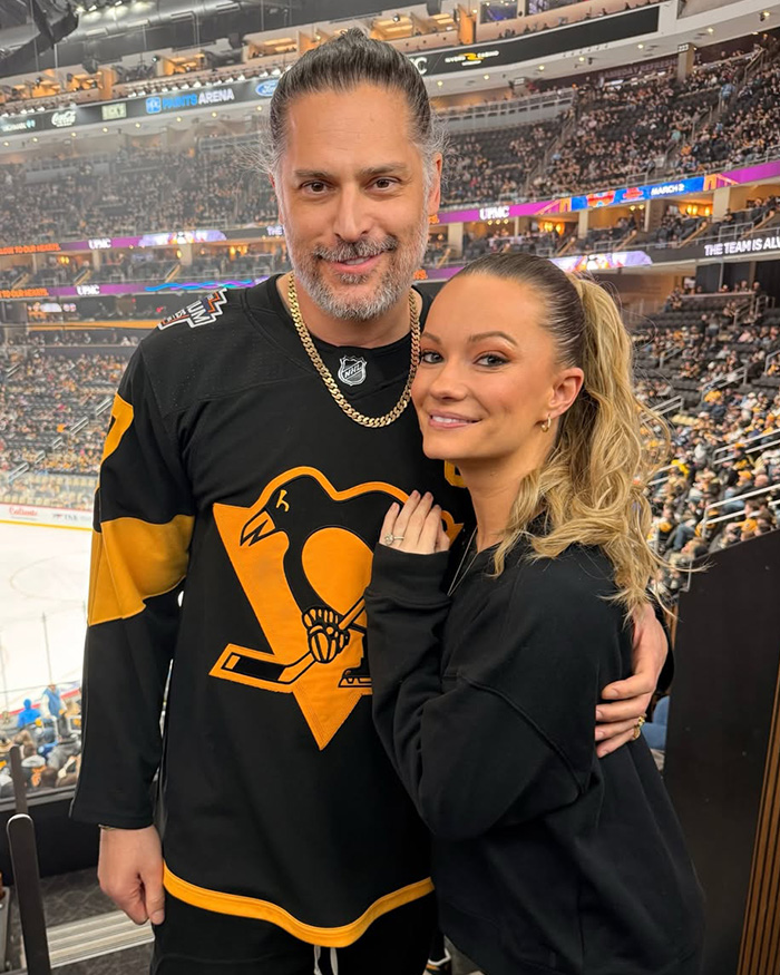 Joe Manganiello smiling with his new partner Caitlin O Connor at a hockey game. Joe Manganiello smiling with his new partner Caitlin O Connor at a hockey game.